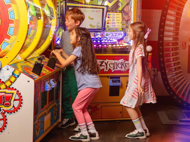 Kids playing in the arcade.