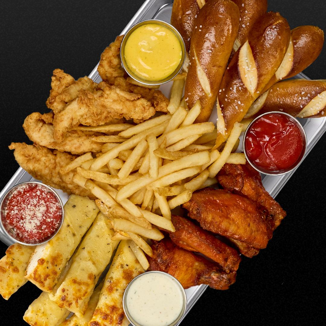 A striking combination of buffalo wings, chicken tenders, cheesy dippers, and bavarian pretzels.