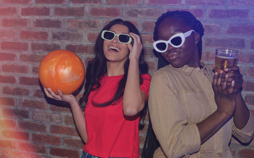 Two bowlers in sunglasses