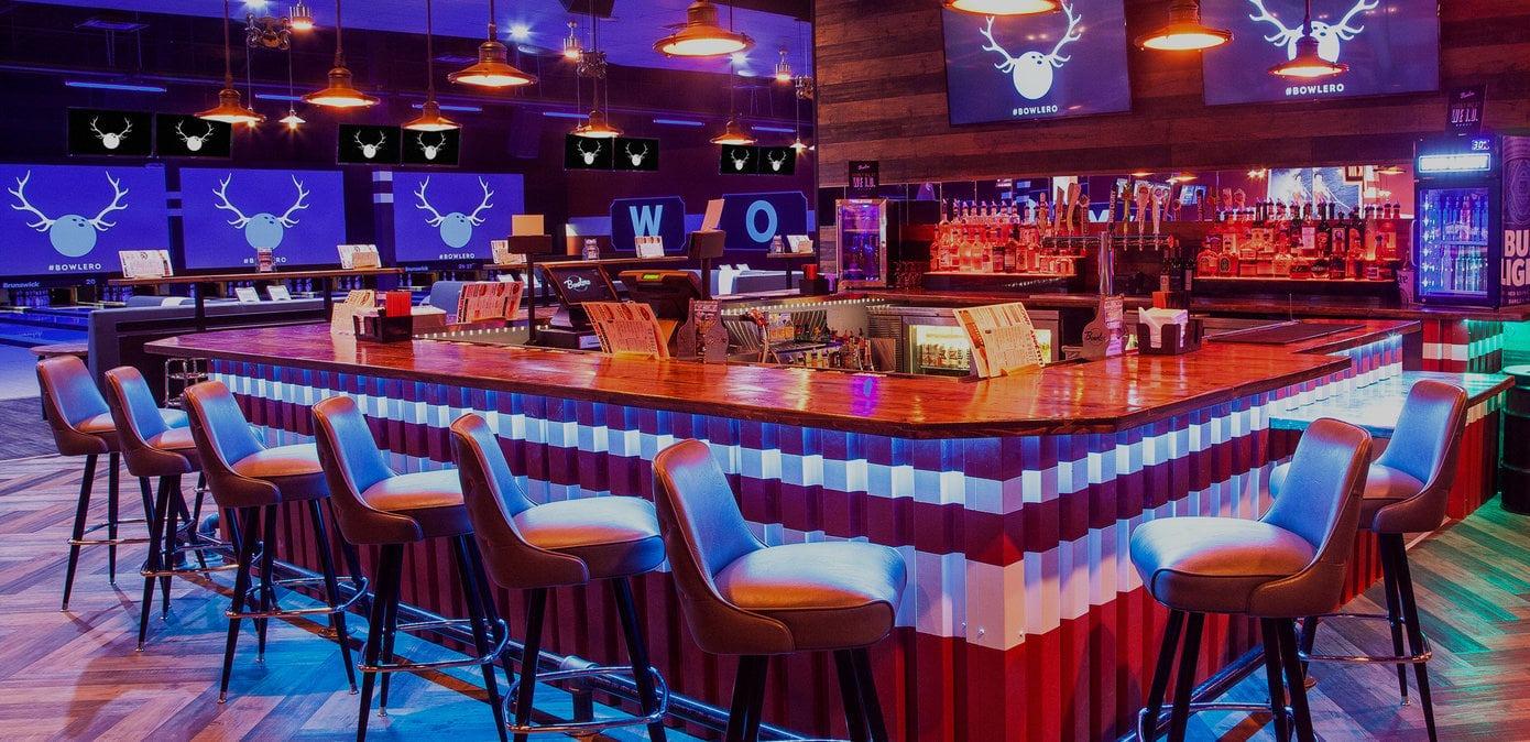 Bar with bowling lanes in the background