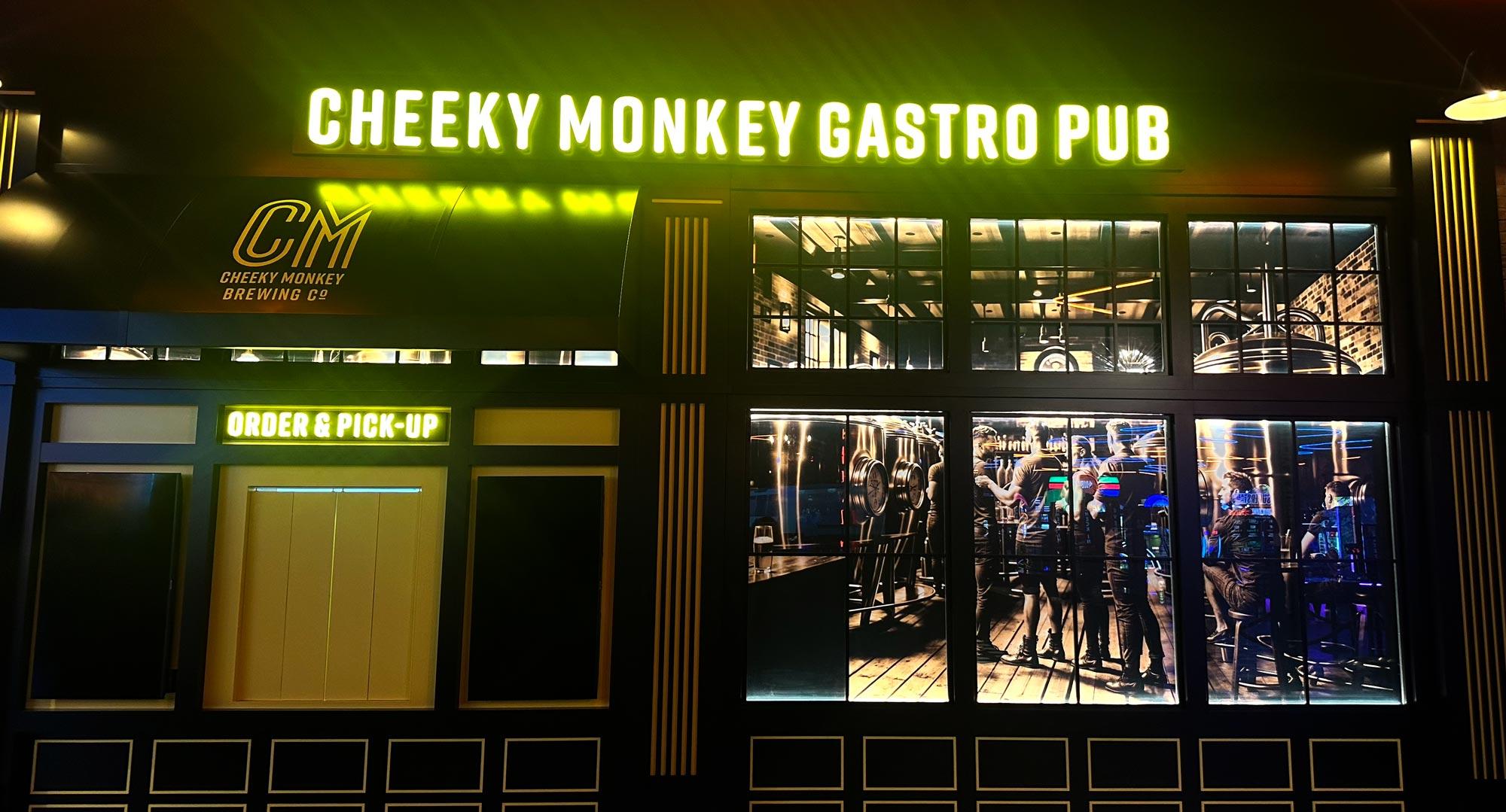 Beautiful gastro pub with light that states Cheeky Monkey Gastro Pub