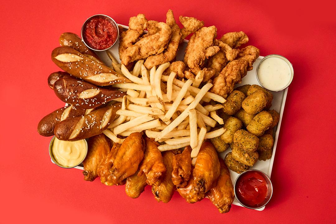 Signature sampler on a tray with a red background. 