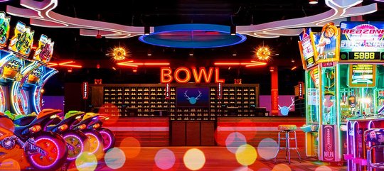 Bowl Front desk with glitter lights and arcade games 